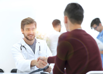 handshake between doctor and patient