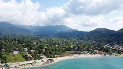 Fototapeta na wymiar Aerial drone photo of famous seaside village and port of Vasiliki famous for trips to Ionian islands and nearby beaches, Lefkada, Greece