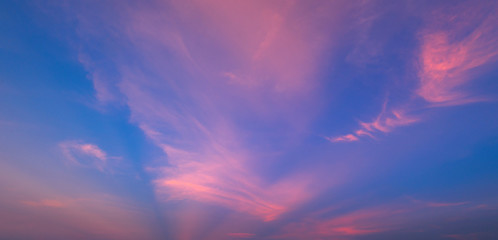  Sunlight with dramatic sky. Cumulus sunset clouds with sun setting down on dark background.orange and dark cloud sky.