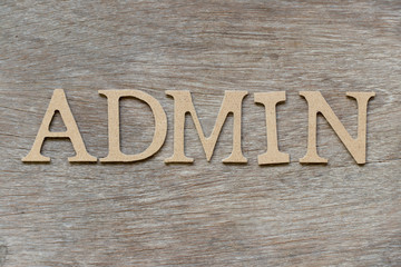 Alphabet letter in word admin on wood background