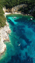 Aerial drone bird's eye view photo of famous caves in Sivota area, Epirus, Greece