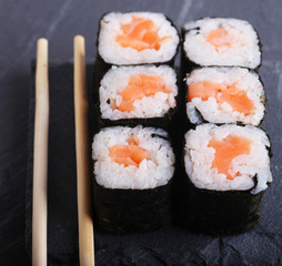 Maki rolls with over grey background. Japanese Sushi. close up. 