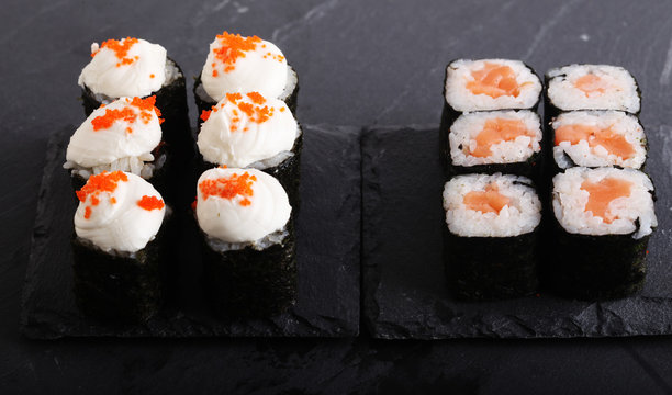 Maki rolls with over grey background. Japanese Sushi. close up. 