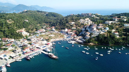 Fototapeta na wymiar Aerial drone bird's eye view photo of famous village and port in bay of Sivota, Epirus, Greece