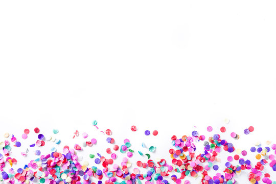 Party background. Party colorful confetti on white background. Top view. Copyspace