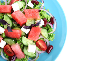 Plate with delicious watermelon salad on white background