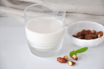Glass of Almond Milk on White Background