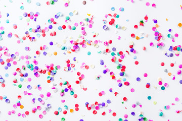 Party background. Party colorful confetti on white background. Top view. 