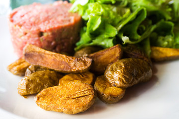 tasty Steak tartare (Raw beef) - classic steak tartare on white plate