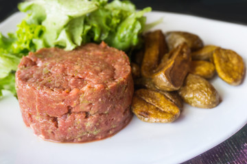 tasty Steak tartare (Raw beef) - classic steak tartare on white plate