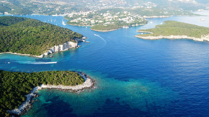 Naklejka na ściany i meble Aerial drone bird's eye view photo of iconic paradise sandy beaches with turquoise sea in complex islands of Agios Nikolaos and Mourtos in Sivota area, Ionian sea, Epirus, Greece