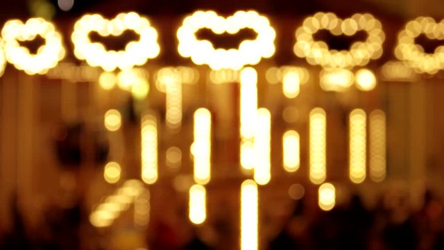 Glowing blurred carousel. Moving background.