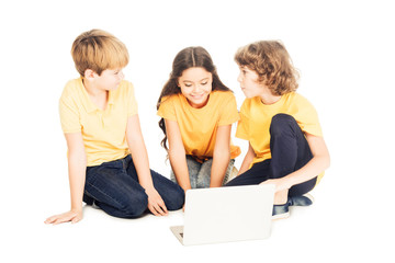 cute smiling kids using laptop together isolated on white