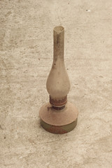 Old vintage gas lamp on the background of concrete