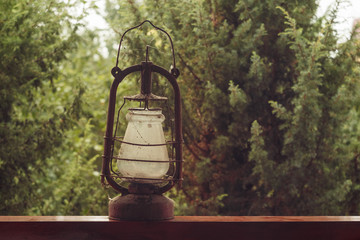 Old vintage gas lamp on green background