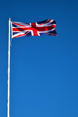 UK Flag on White Pole in WInd