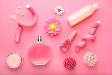 Flat lay composition with cosmetics on pink background