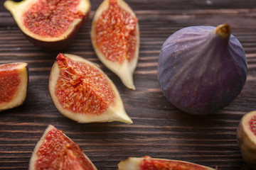 Fresh ripe figs on wooden table