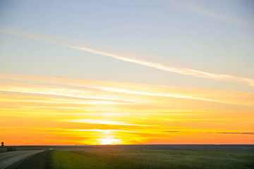 orange sunset abstraction. Blue sky, sun, clouds