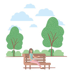 young woman seated in chair on the park