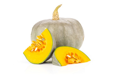 Group of one whole two slices of fresh blue grey pumpkin nagy dobosi variety isolated on white...