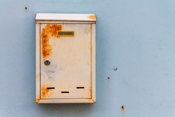 A beautiful mailbox hangs waiting for newspapers, parcels and letters.