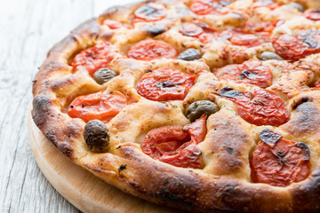 Focaccia typical of Bari Italy with tomatoes and olive