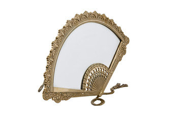 Women's table mirror in a gold frame.