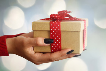  Hands holding Christmas gift box