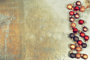 Grunge Christmas background with border of Christmas balls, copy space