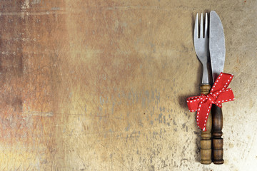 Vintage cutlery on grunge background with copy space, top view