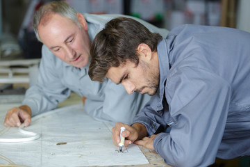 men discussing drawing