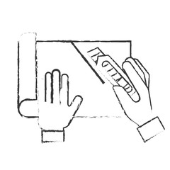 graphic designer hands cutting a paper