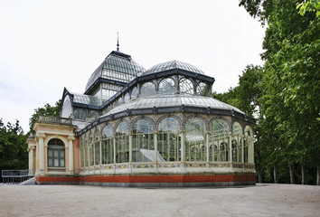 Fototapeta na wymiar Crystal Palace (Palacio de Cristal) at Buen Retiro park (Park of Pleasant Retreat) in Madrid. Spain