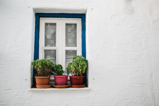Window with pots on Paros, Greece