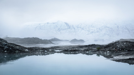 Fototapeta na wymiar Thick fog over the toe of the Matanuska Glacier