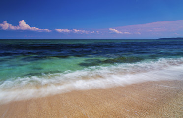 Beautiful summer landscape with sea waves on the beach
