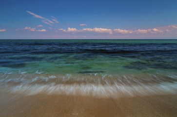 Beautiful summer landscape with sea waves on the beach
