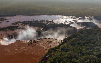 Top view of the Iguazu waterfalls, parana river and huge rainforest spaces.