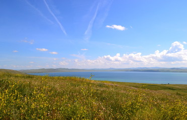 lake behind the hill