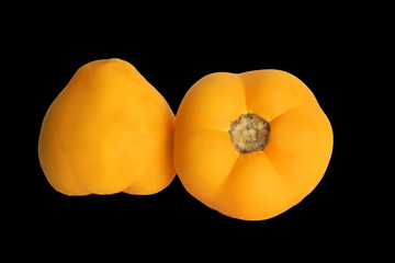 Yellow tomatoes on a black background