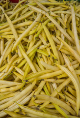 Fresh pods with white beans in a large box