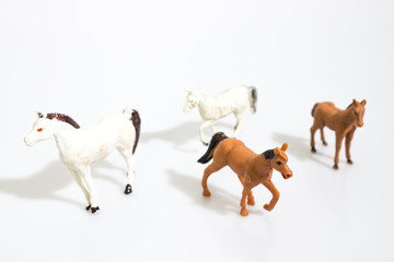Christmas objects, plastic animals horses  for nativity diorama isolated in a white background