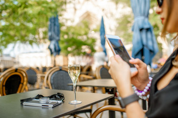 Woman with a glass of champagne in Reims, France