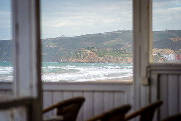 Fototapeta na wymiar Saaidia Beach and waves from restaurant