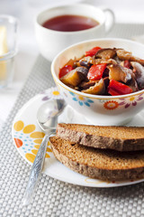 Vegetable sauté with eggplant, red pepper and tomatoes, and toasted rye bread