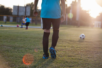 Soccer players practicing on a field.