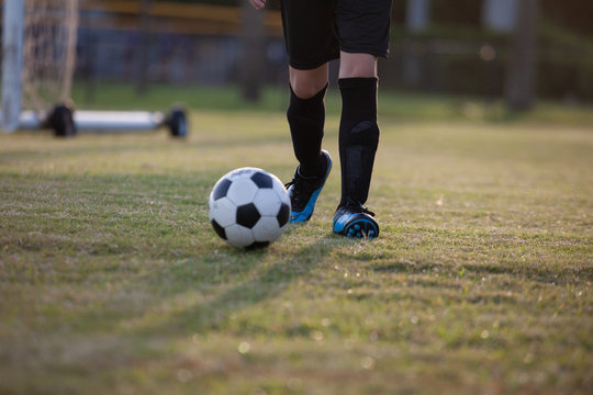 Soccer players practicing on a field.