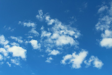 Naklejka na ściany i meble Beautiful blue sky and white cumulus clouds. Background. Landscape.