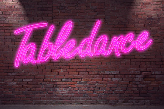 Leuchtreklame Tabledance an Ziegelsteinmauer